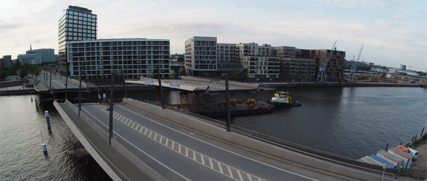 Watch part of Baakenhafen Bridge in Hamburg, Germany removed to allow passage of tall ship image